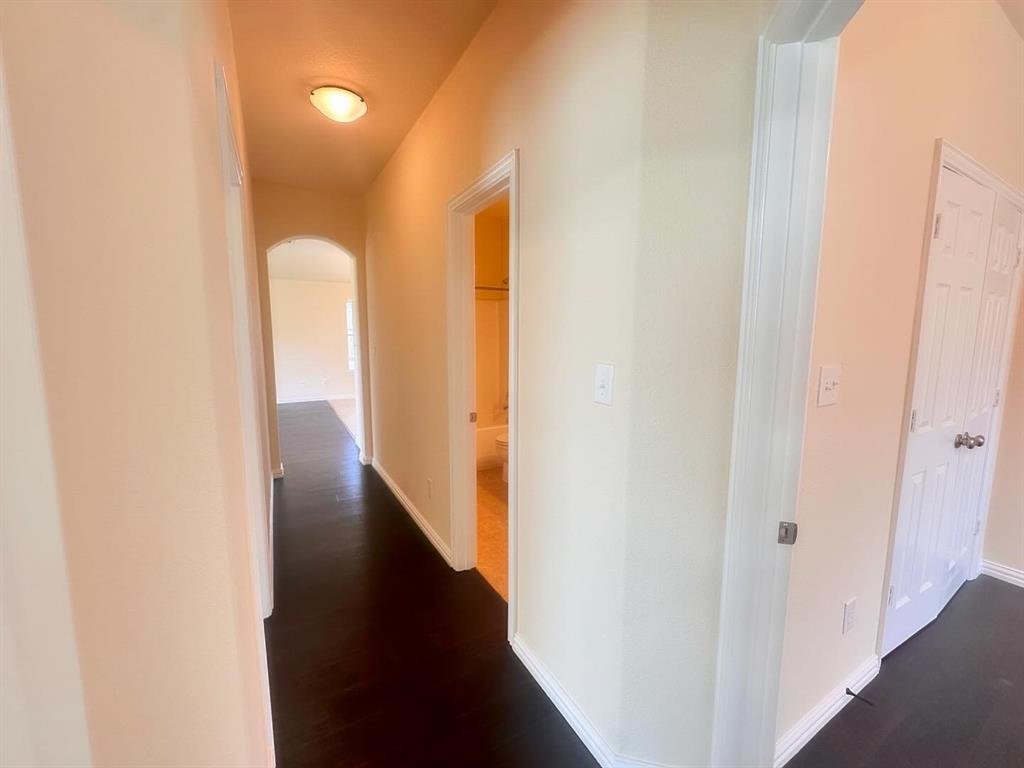 Hallway featuring dark hardwood / wood-style floors