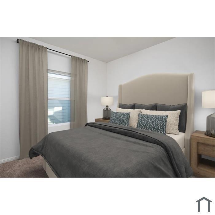 Neutral-toned room featuring wall-to-wall carpeting and a single-pane window