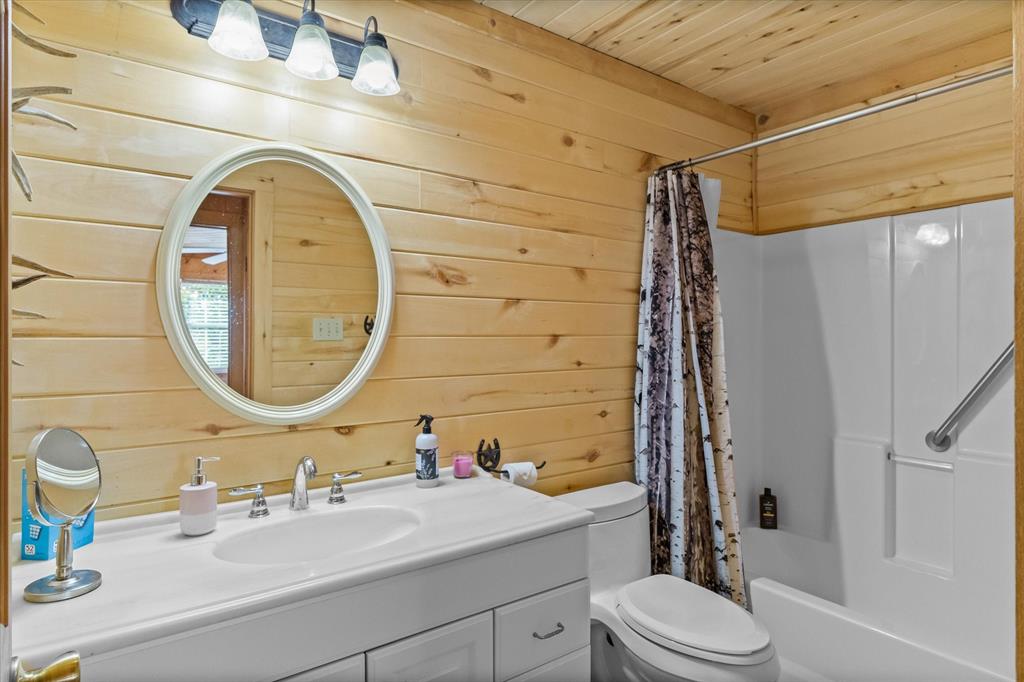 Corian counters and tub shower in the hall bathroom