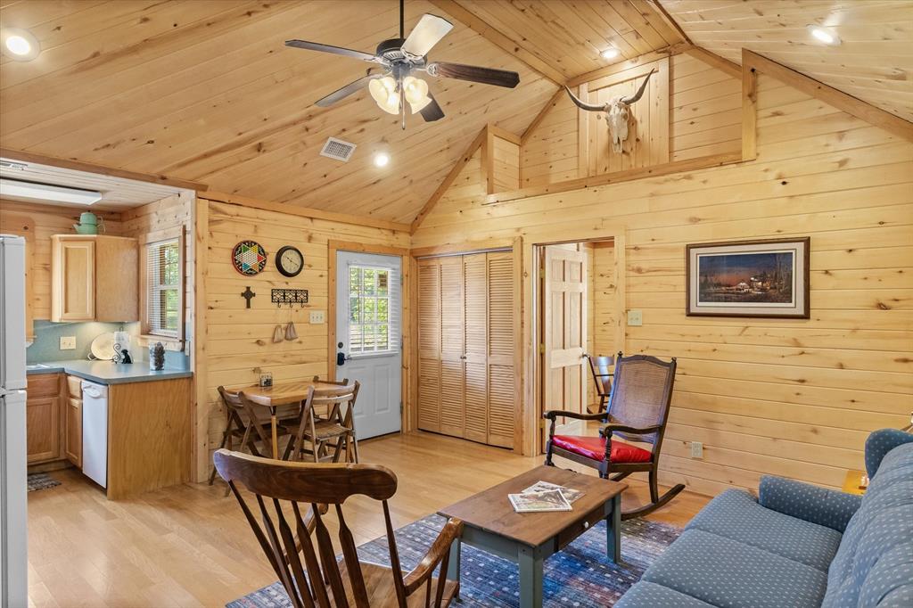Vaulted ceilings and a decorative hay loft area add to the charm of this home.