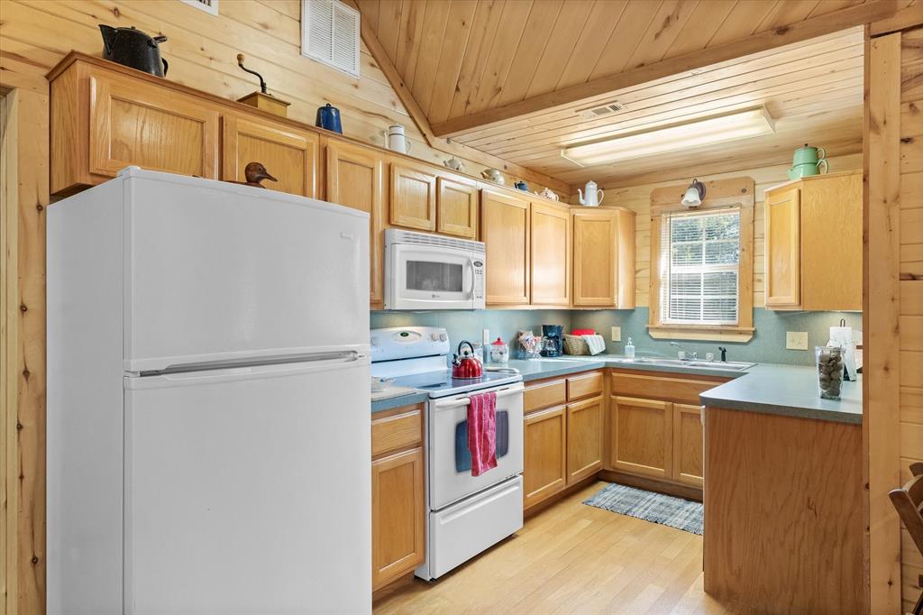 Full kitchen with everything you need including a kitchen sink window