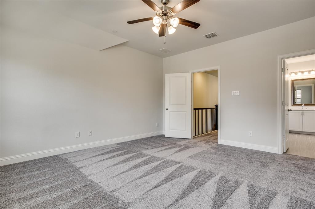 Room featuring neutral wall tones, plush wall-to-wall carpeting, and a multi-light ceiling fan