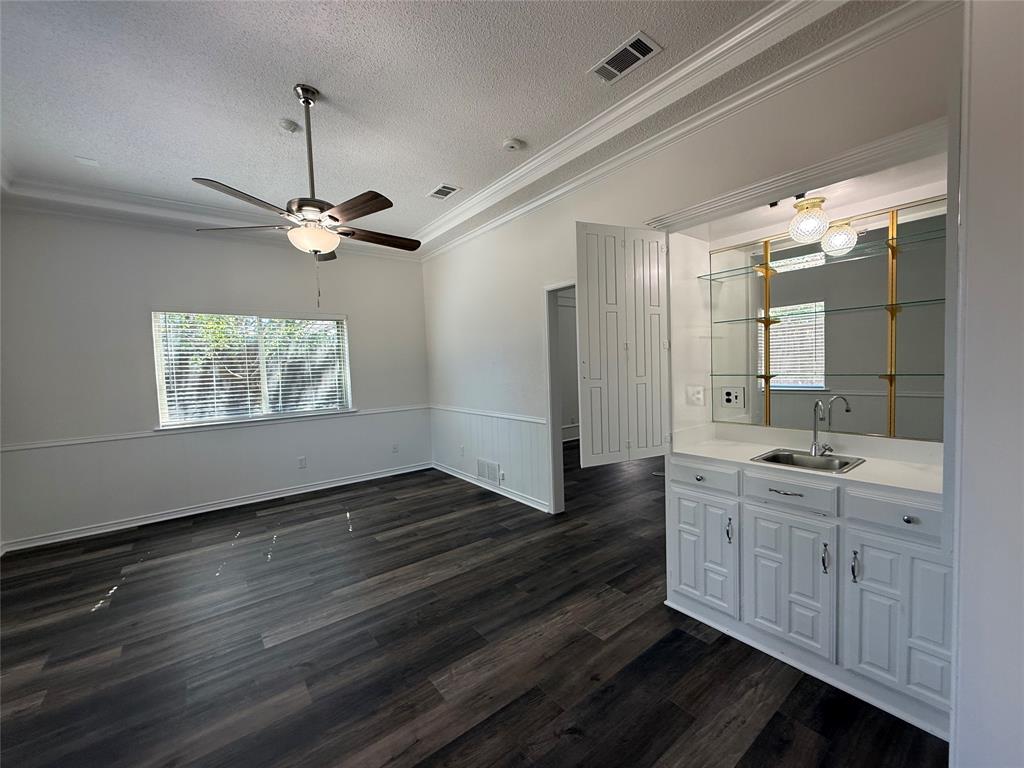 Family room with wet bar off of kitchen and living room