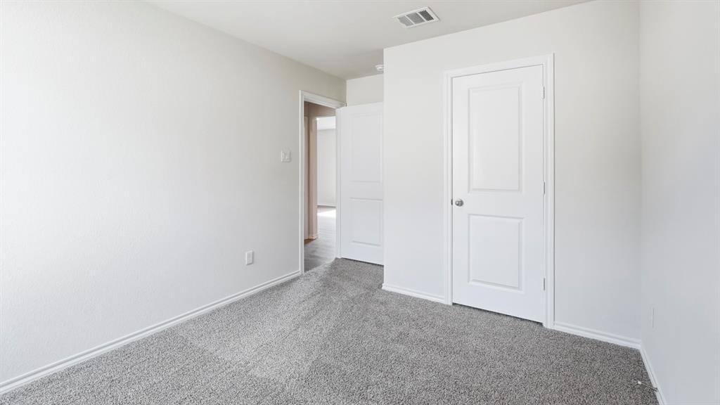 Light gray carpeting with neutral white walls