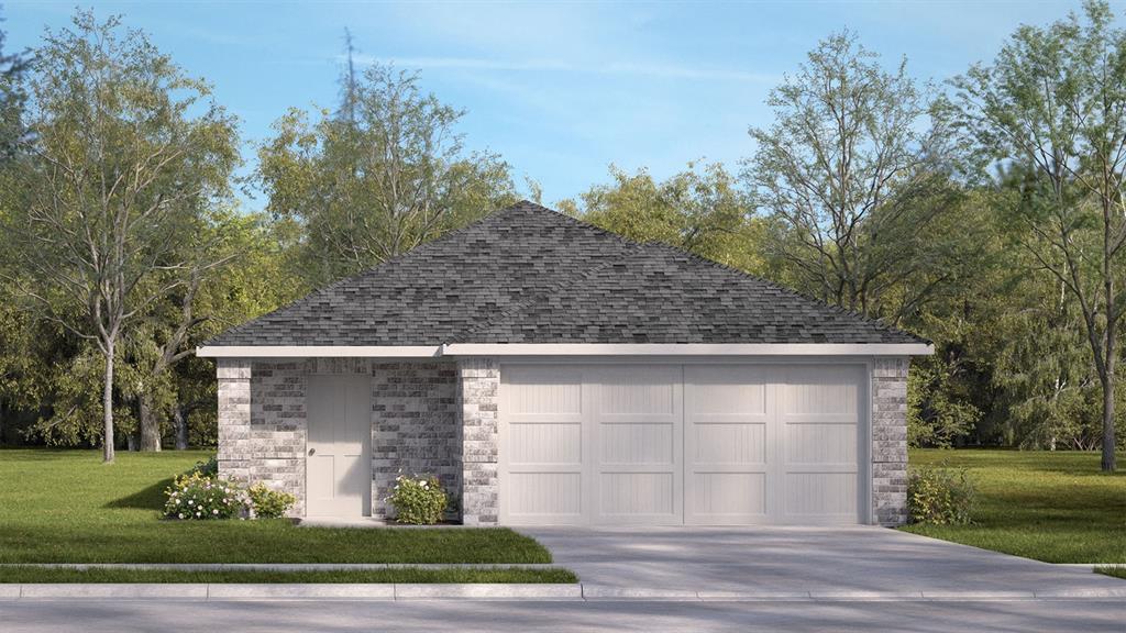 Detached two-car garage featuring a brick exterior, shingled hip roof, concrete driveway, and side-entry door