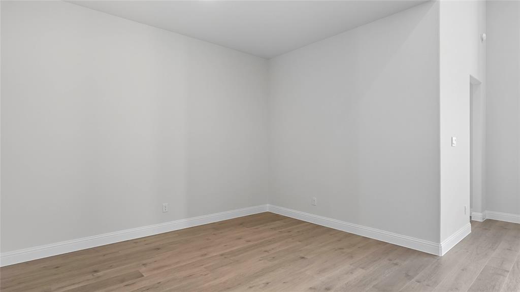 Neutral-toned walls and wood-finish flooring