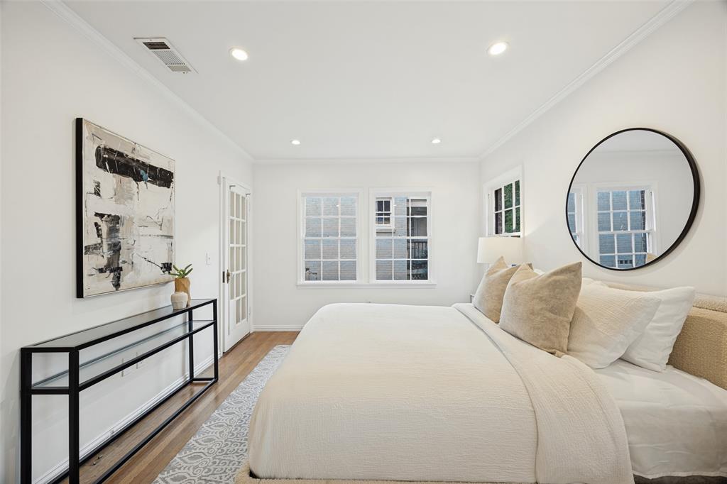 Interior space featuring recessed lighting, wood-finish flooring, multi-pane windows, and a glass-paneled door