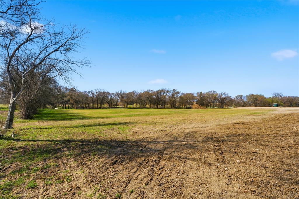 Expansive acreage featuring cleared land, mature tree lines, and open pasture