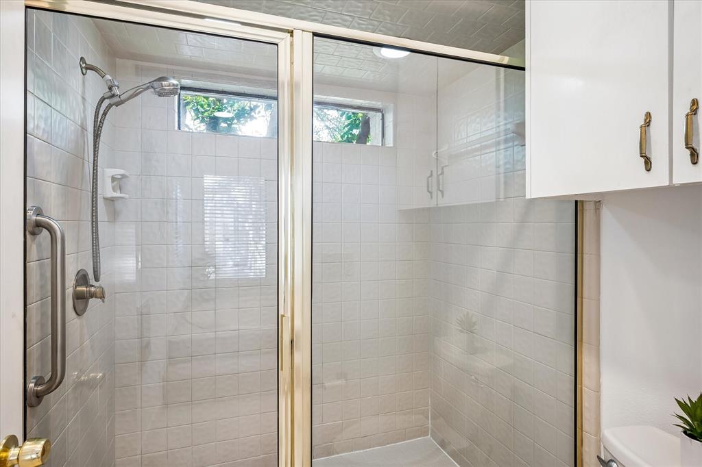 Primary bathroom has a large walk-in shower.