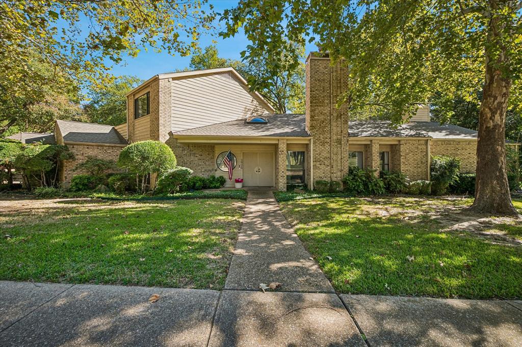 Unique architectural designed home on a large landscaped creek lot is very desirable.  The home is constructed of brick and cedar.  Engaging front door is a crafted work of art.  Wonderful drive-up appeal.