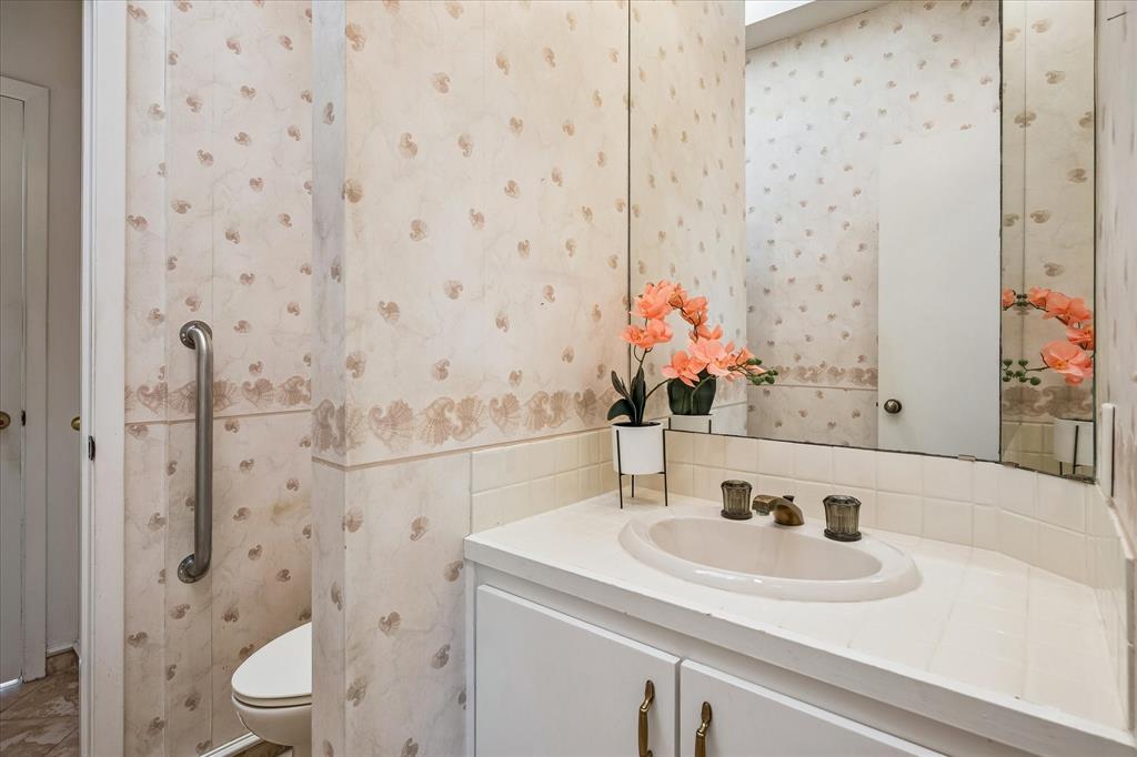 Half bath on the first floor provides a nice place for guest with easy access either from the kitchen or living room.