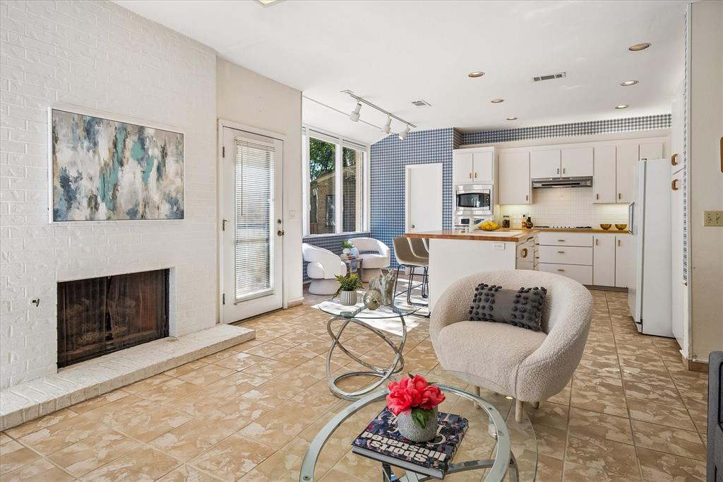 Another view of the family room looking into the kitchen and a door leading out to the backyard.