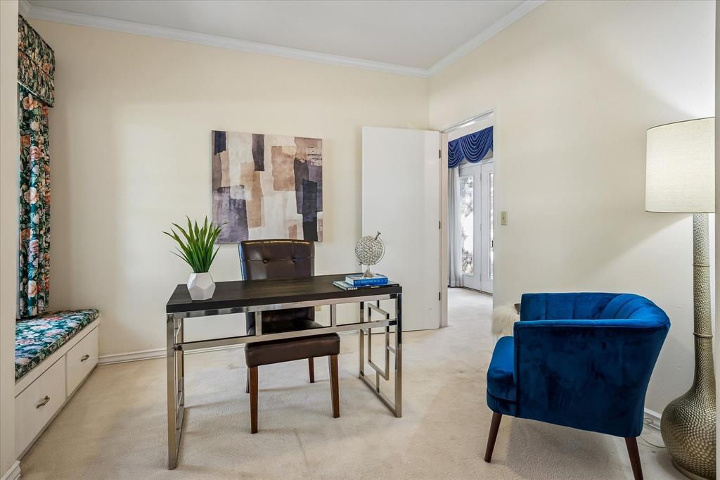 The office is located right off the primary bedroom has a large window with a sitting area underneath with additional storage.