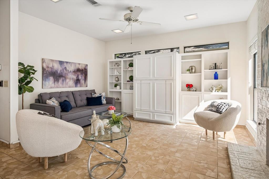 Another view of the family room with the polished ceramic tile flooring from Italy.  You also can see the small decorative windows above the built-ins bringing in natural light into the room.