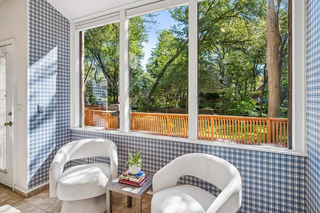 Truly a wonderful view of the backyard which the breakfast area is currently being displayed as a sitting area, but could easily be replaced with a kitchen table and chairs.