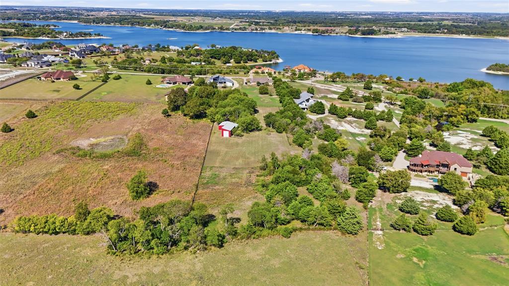 Expansive acreage featuring mature trees, a detached structure, and proximity to the shoreline