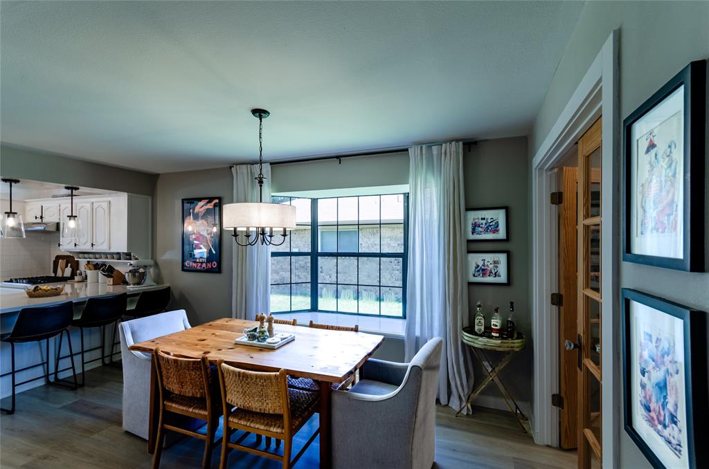 Open concept dining area with wood-finish flooring