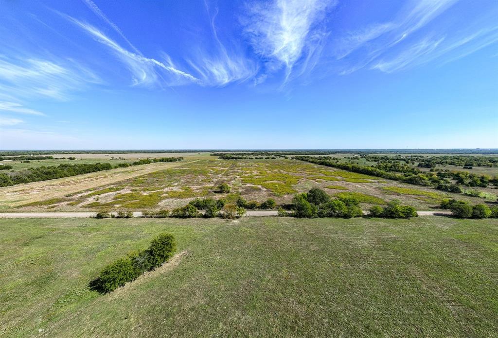 Expansive acreage featuring cleared pasture land, clusters of mature trees, and direct road access Expansive acreage featuring cleared pasture land, clusters of mature trees, and direct road access