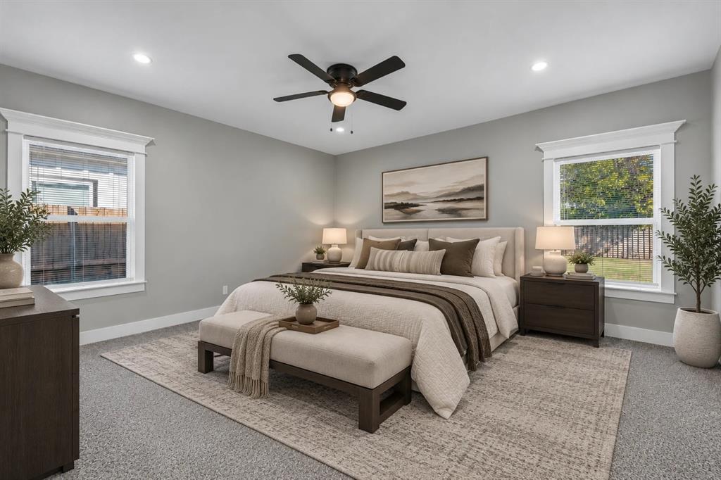 Neutral wall color, recessed lighting, ceiling fan with integrated light fixture, and windows with prominent millwork trim