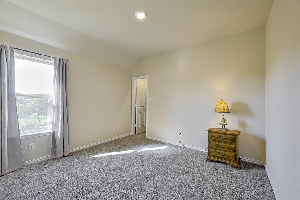Neutral-toned interior space featuring neutral wall paint, recessed lighting, carpeted flooring, a single window, and a multi-panel door