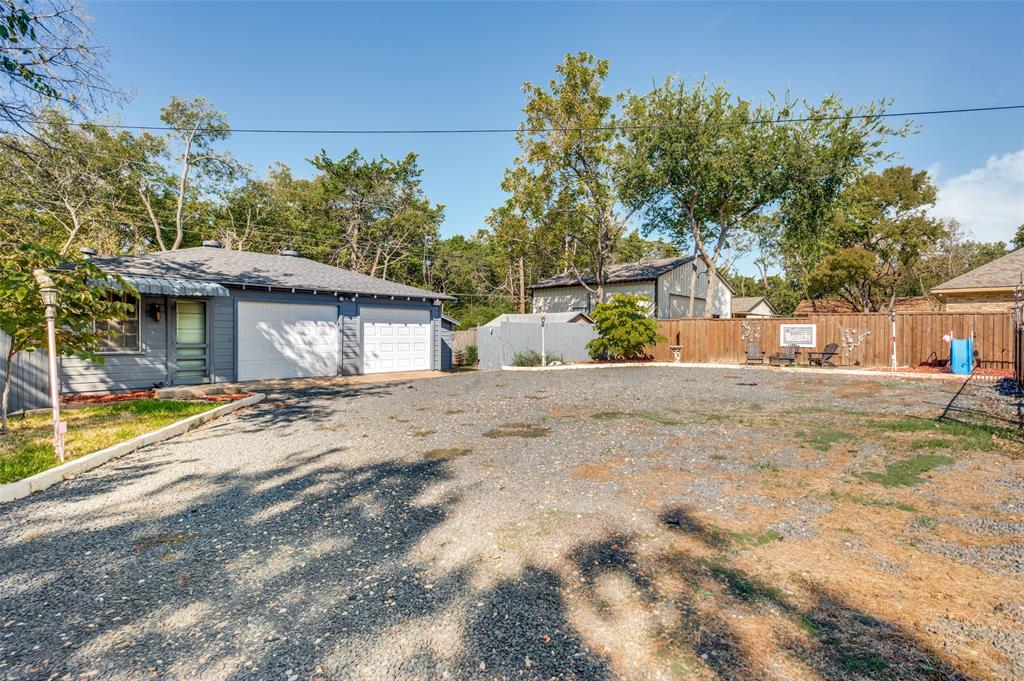 Tons of usable space at the rear of the property, including a detached 2-car garage, multiple storage buildings, and an enclosed 21x9 space that could be used for an office or workout room. It has a half bathroom that needs remodeling.