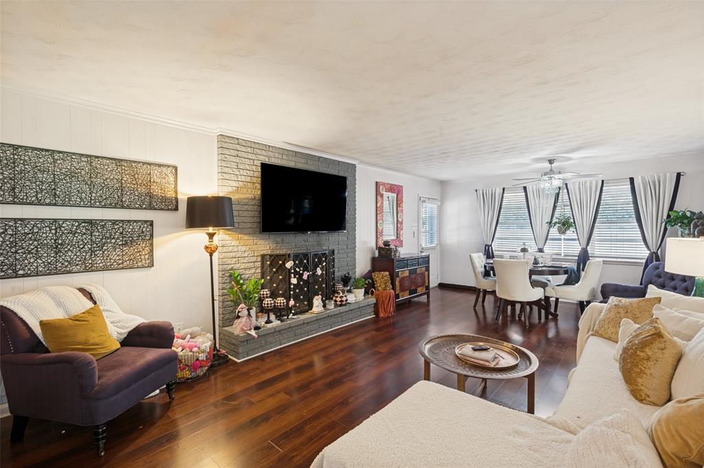 The heart of the home is the cozy living room with fireplace, adjacent to the dining space.