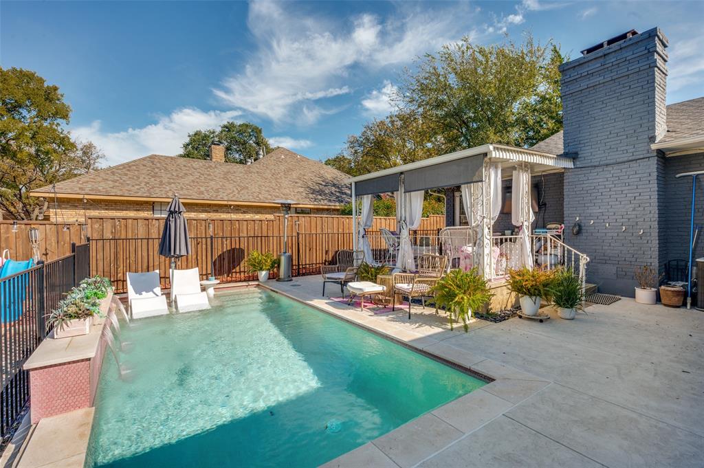 A beautiful waterfall complements the private pool with huge surrounding patio.