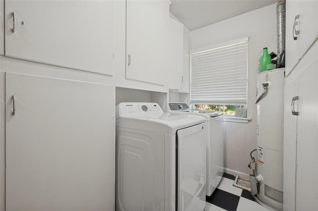 Off the kitchen is a full-sized laundry room and large pantry space.