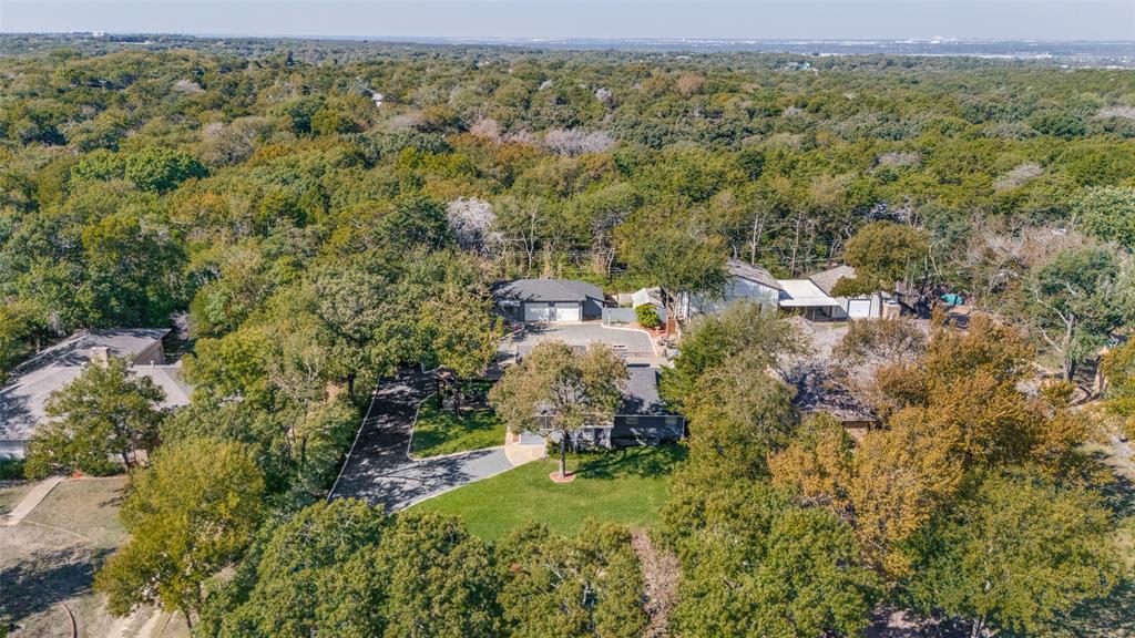 View from the front showing the great trees and privacy enjoyed by this property.