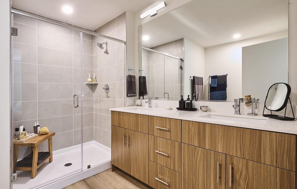 Full bathroom with a shower stall, double vanity, and recessed lighting Full bathroom with a shower stall, double vanity, and recessed lighting