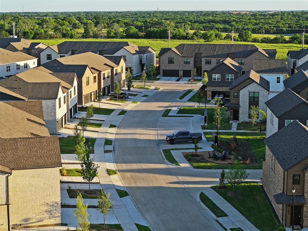 Aerial view of residential area featuring a heavily wooded area Aerial view of residential area featuring a heavily wooded area