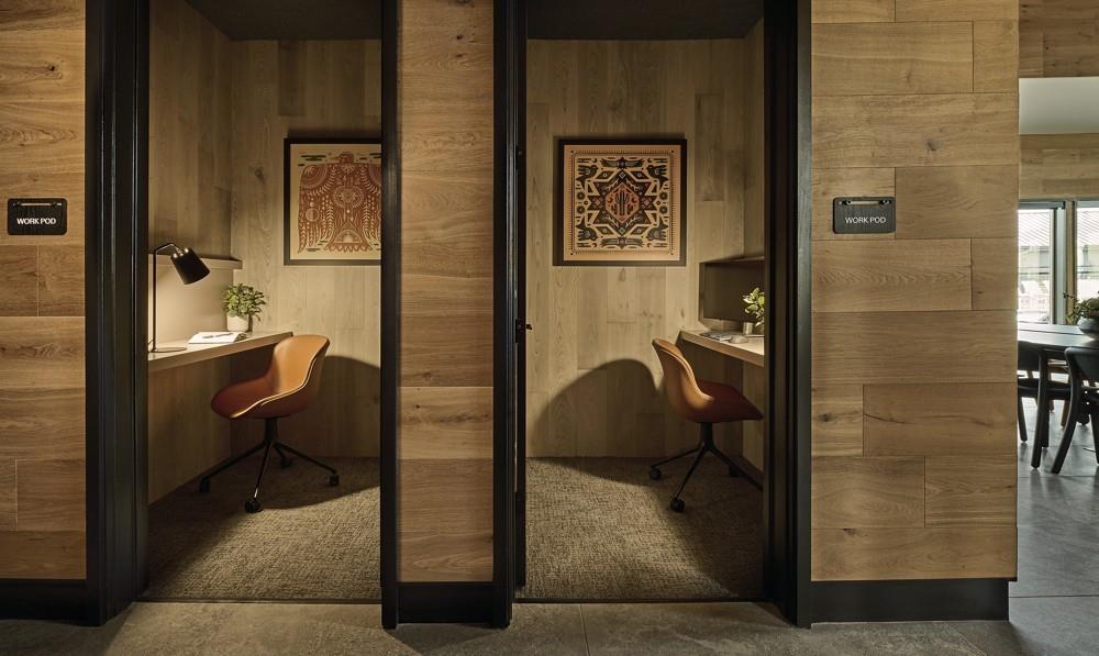 Home office featuring wooden walls