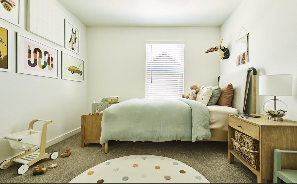 Bedroom with carpet flooring and baseboards Bedroom with carpet flooring and baseboards