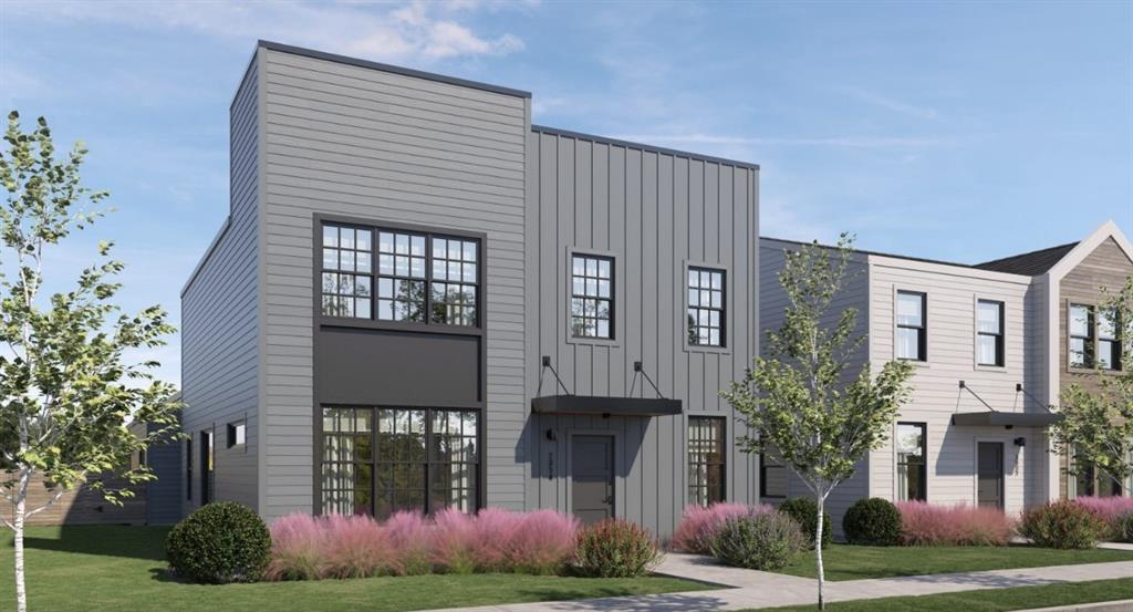 View of front facade featuring board and batten siding and a front lawn View of front facade featuring board and batten siding and a front lawn