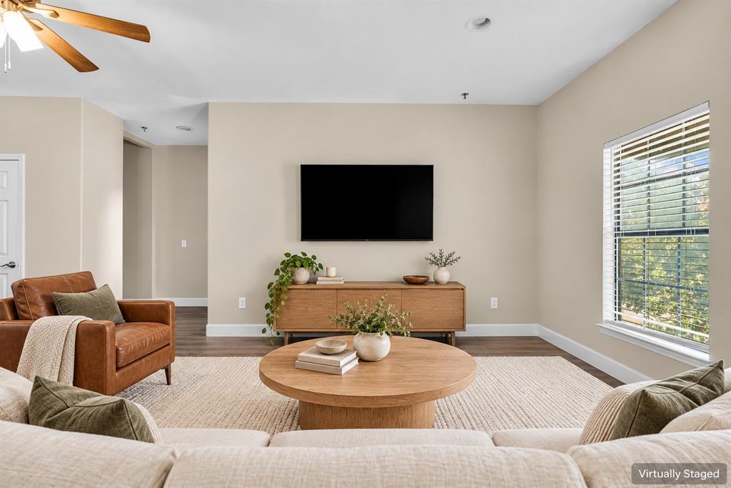 Neutral interior with wood-finish flooring, recessed lighting, and a ceiling fan