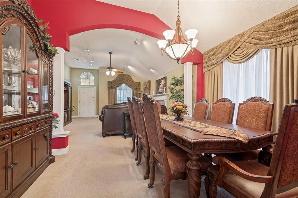 Vaulted ceilings, arched architectural detailing, multi-arm chandelier, and oversized windows Vaulted ceilings, arched architectural detailing, multi-arm chandelier, and oversized windows