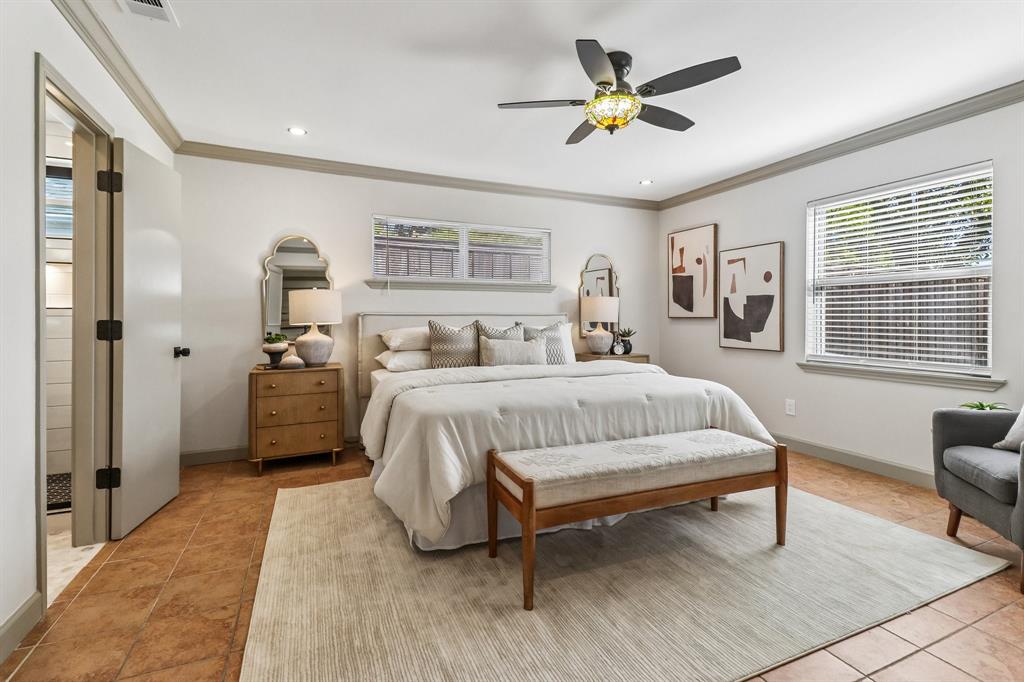 Recessed lighting, crown molding, and a ceiling fan with an ornamental light fixture