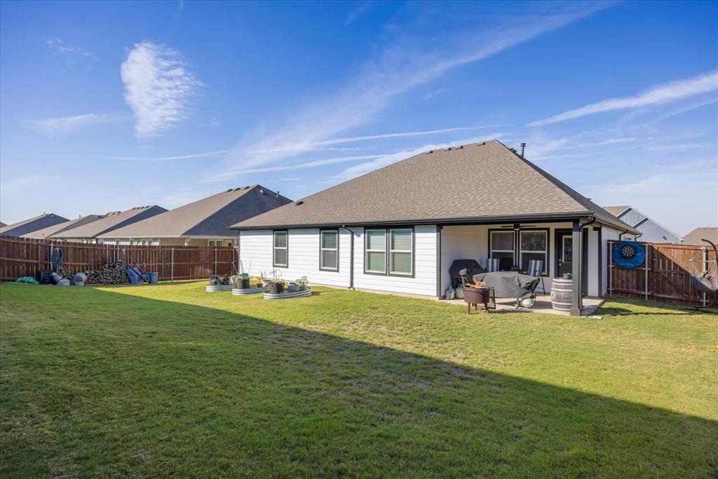 Large, fully fenced backyard.