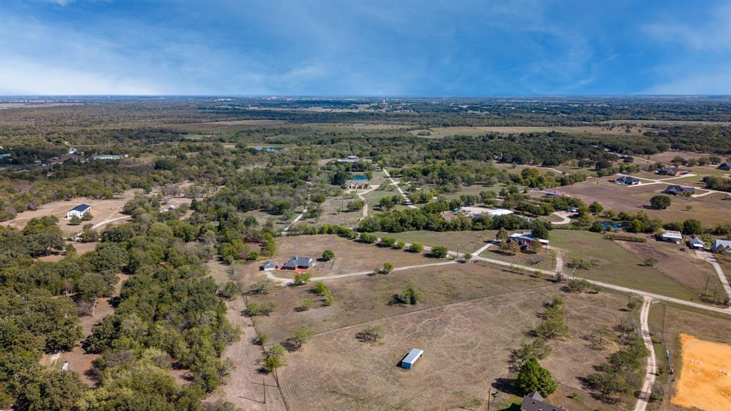 Expansive acreage featuring mature trees, open pasture, and private gravel roads