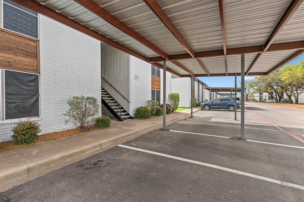 Community covered parking and walkway at The Ashton on 287. Community view, not the specific exterior or interior of this unit. Covered parking is optional; confirm availability and charges. Community covered parking and walkway at The Ashton on 287. Community view, not the specific exterior or interior of this unit. Covered parking is optional; confirm availability and charges.