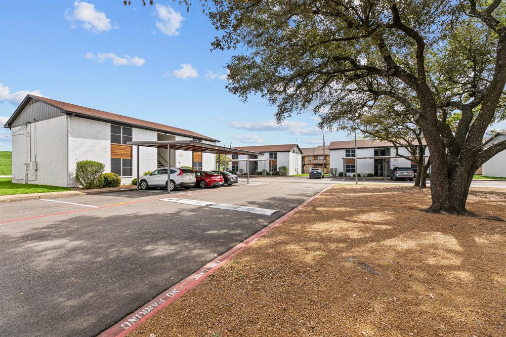 Community exterior and drive at The Ashton on 287. Community view, not the specific exterior or interior of this unit.