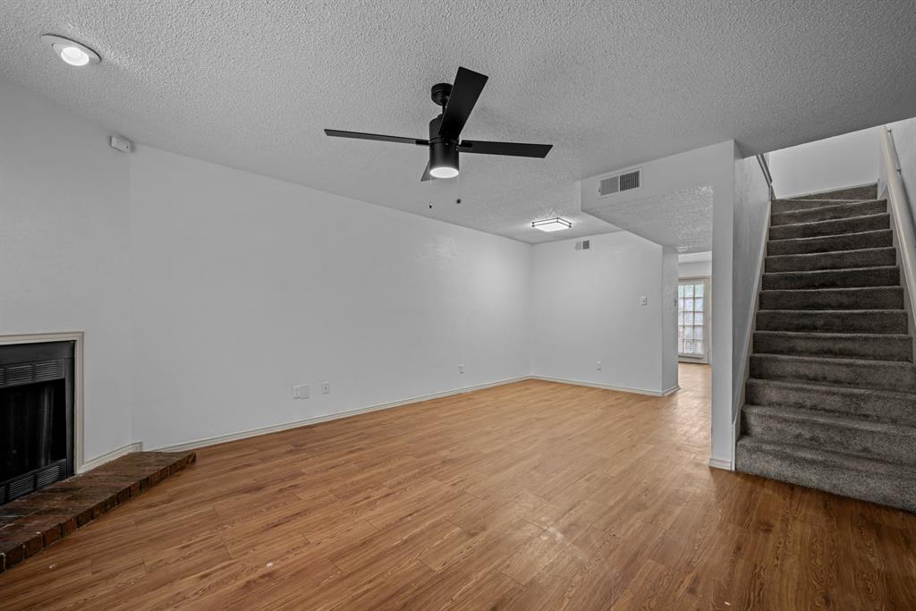 Management living room marketing photo. Exact unit unconfirmed; layout and finishes may vary.