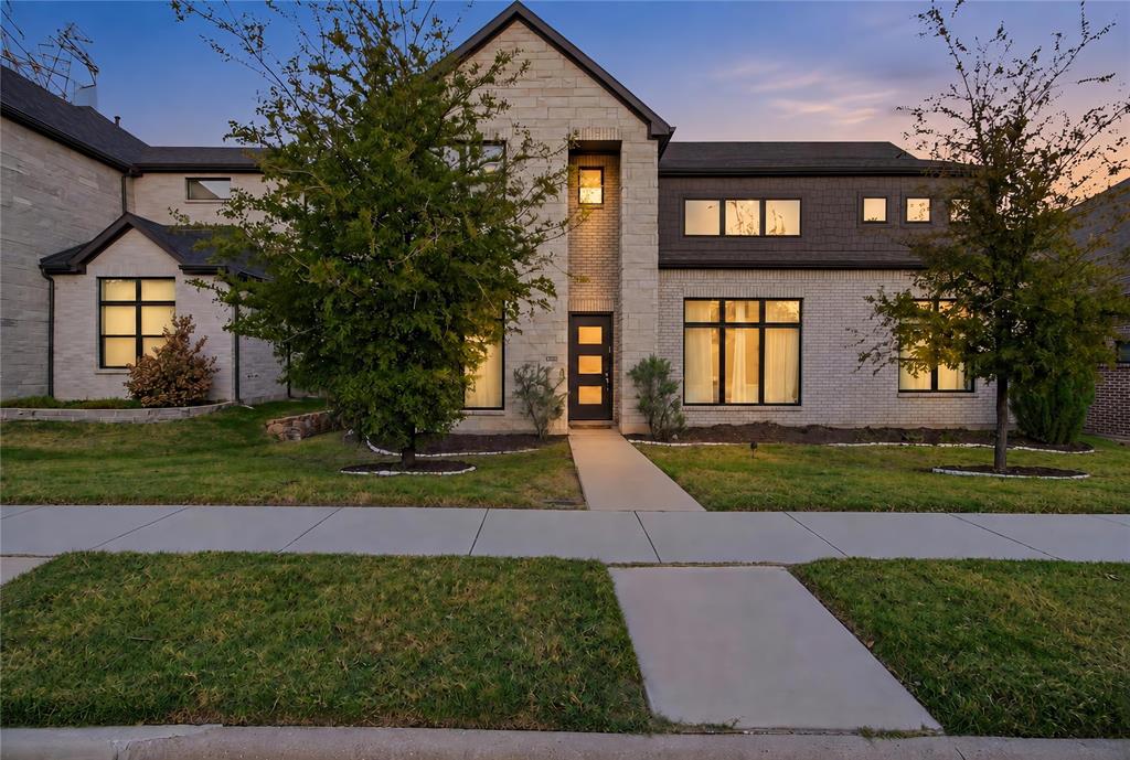 Contemporary exterior featuring light-toned masonry, a steep-pitched roofline, multi-pane windows, and a structured concrete entryway Contemporary exterior featuring light-toned masonry, a steep-pitched roofline, multi-pane windows, and a structured concrete entryway
