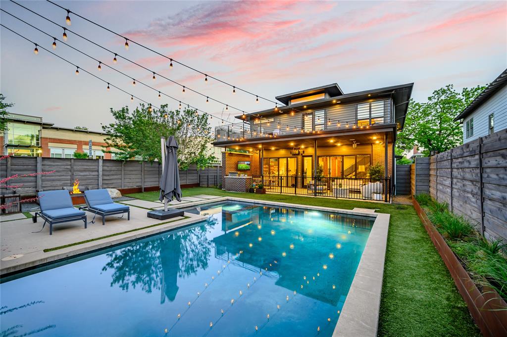 Poolside evenings, glowing lights, and a home made for entertaining—this is life at 5645 Vickery Boulevard.