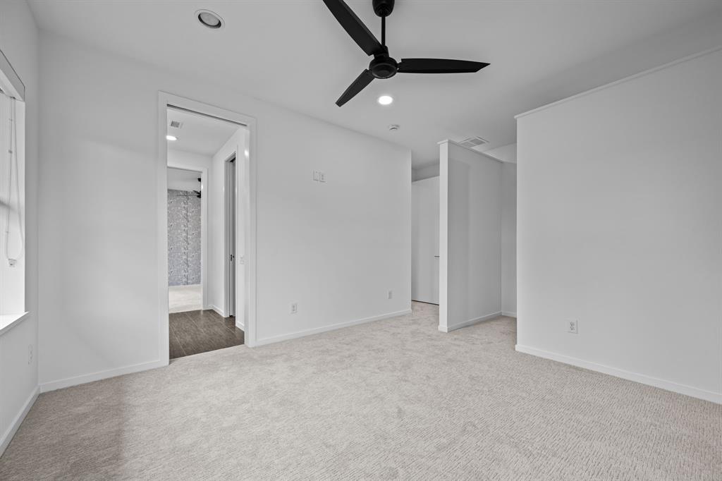 Direct access to the shared Hollywood bath adds convenience to this secondary bedroom.