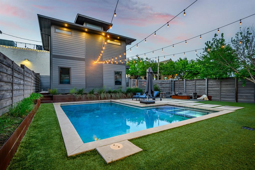 The pool and spa connect the main home and guesthouse in a backyard designed for memorable gatherings.