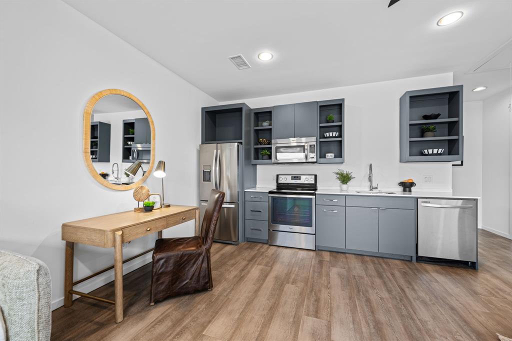 A full kitchen gives the guesthouse everyday independence, complemented by its own laundry and closet storage.