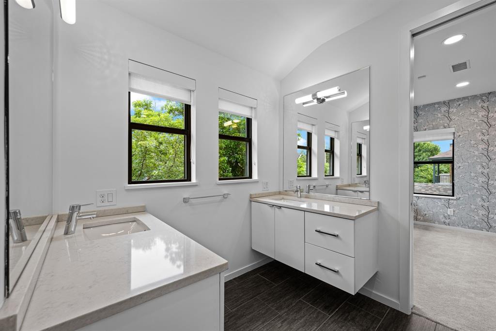 Separate vanities give the shared Hollywood bath room for individual routines.