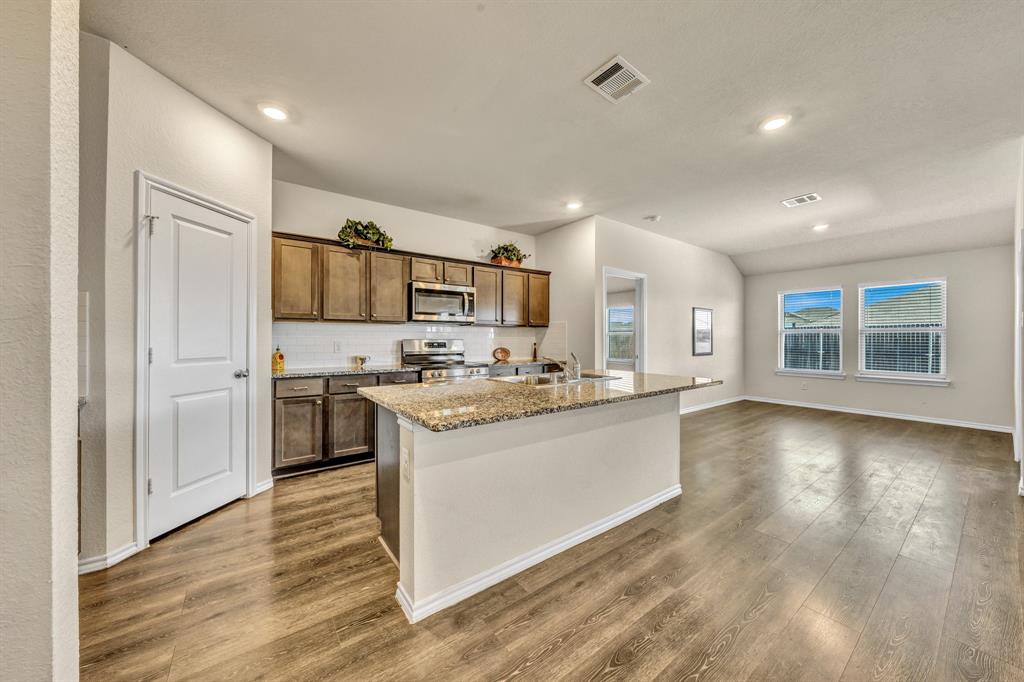 Kitchen has a walk in pantry on the left