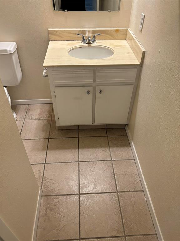 Bathroom with tile flooring and oversized vanity